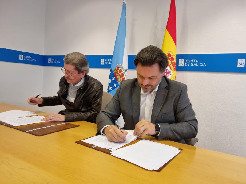Miranda y Búa, en la sede de la SXE en la capital de Galicia, durante la firma del convenio